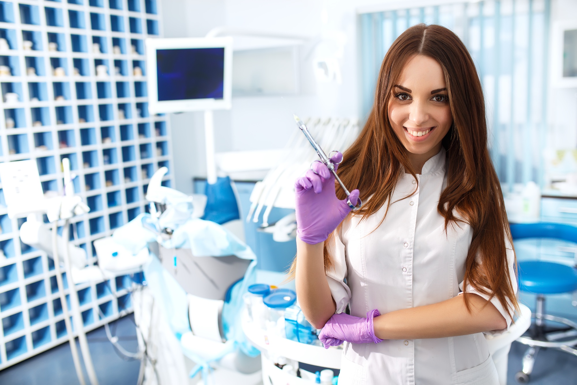 Portrait of young girl on background of the dentist's office. Orthodontic Treatment. Healthy Smile.